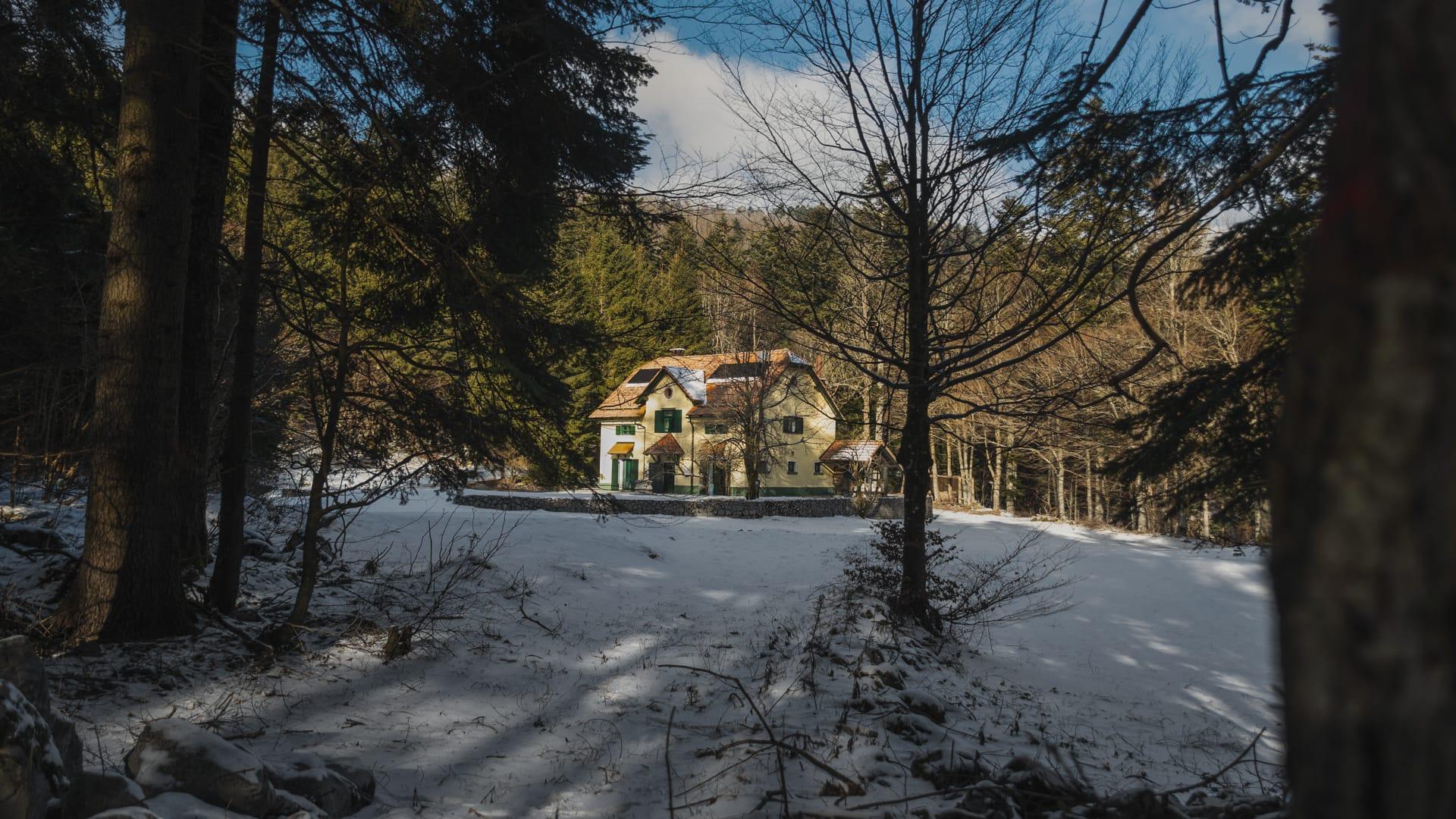 House under Javorniki background